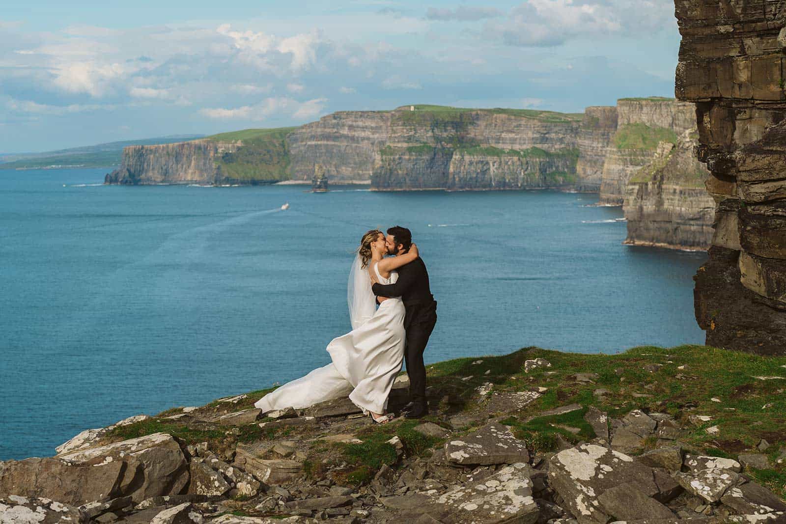 Couple kissing on cliffs of MOher