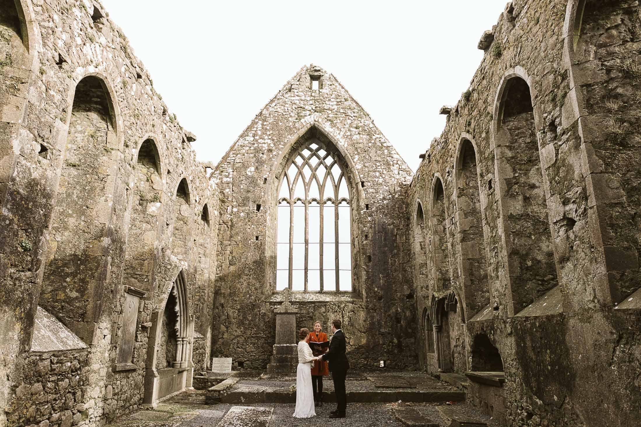 a couple elope in an abbey ruin