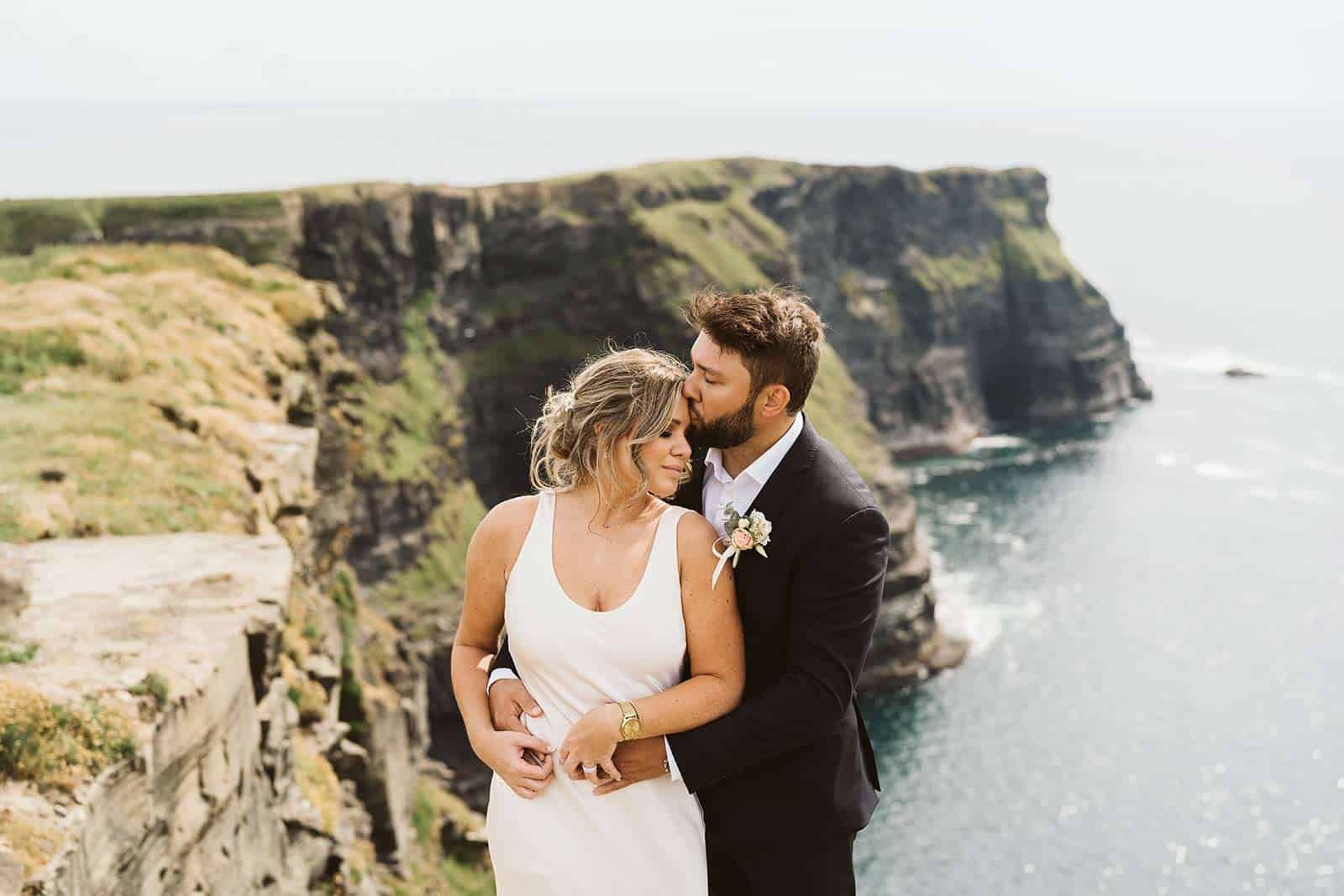 couple on the cliffs eloping in ireland