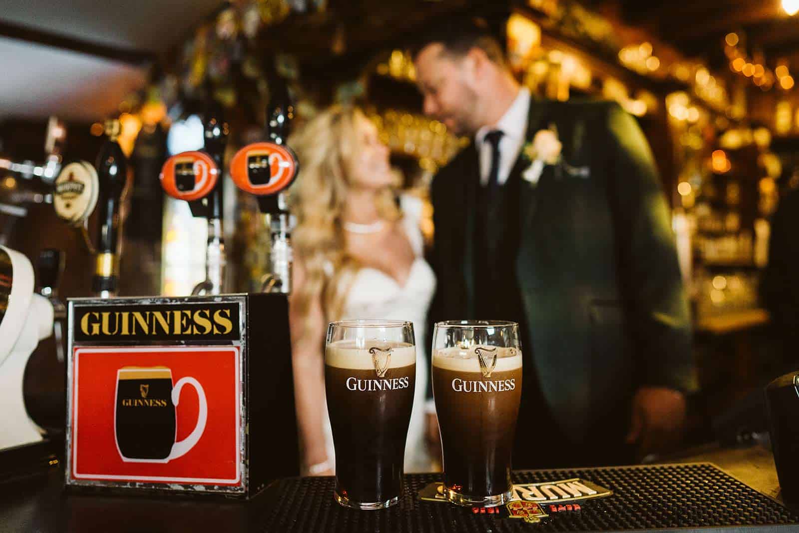 couple having Guinness when eloping in ireland