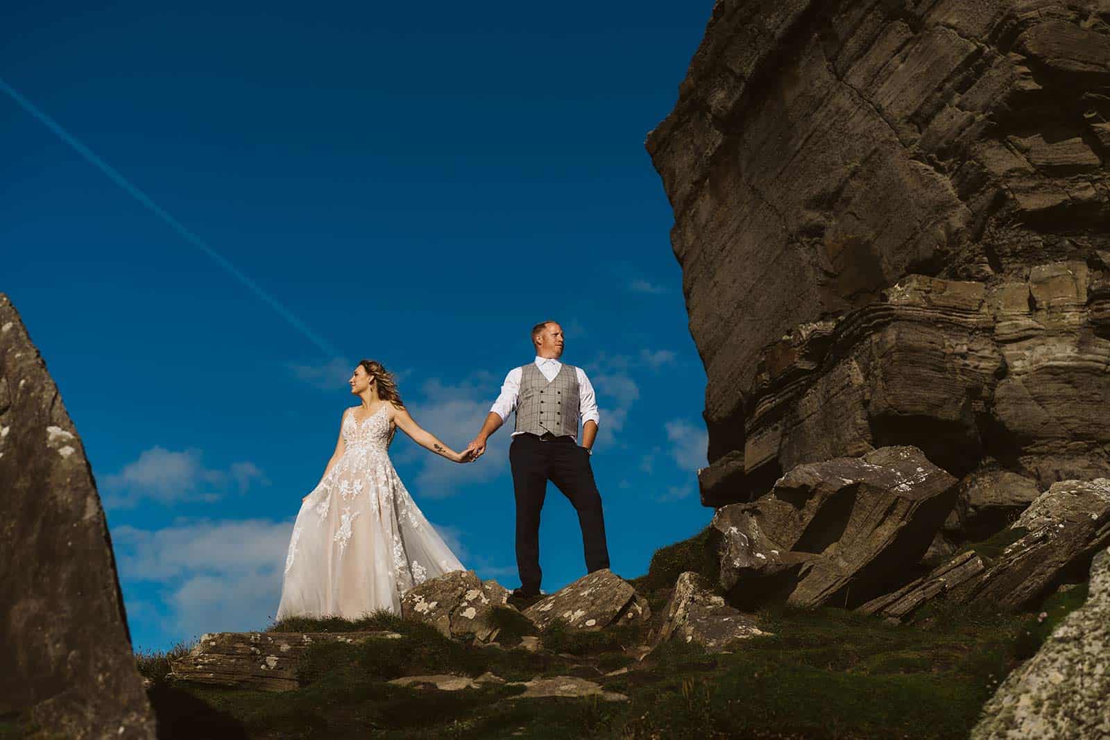 couple eloping in ireland on cliffs of moher