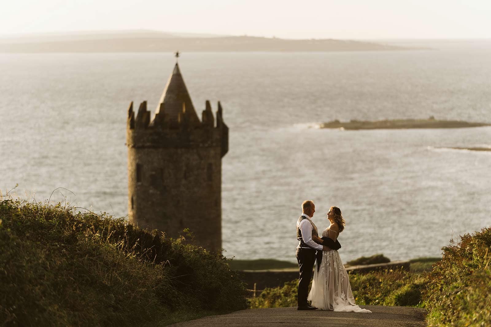 couple on road at sunset while eloping in Ireland