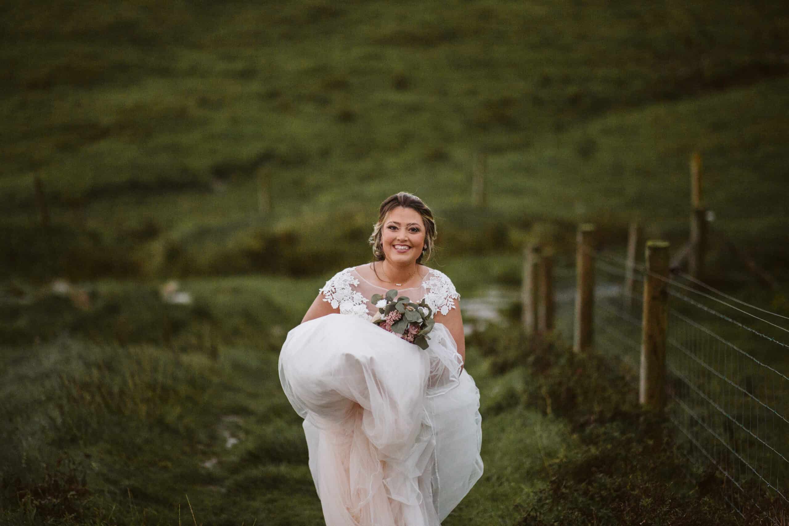 Cliffs of Moher Wedding Hags head, bride laughing as she walks