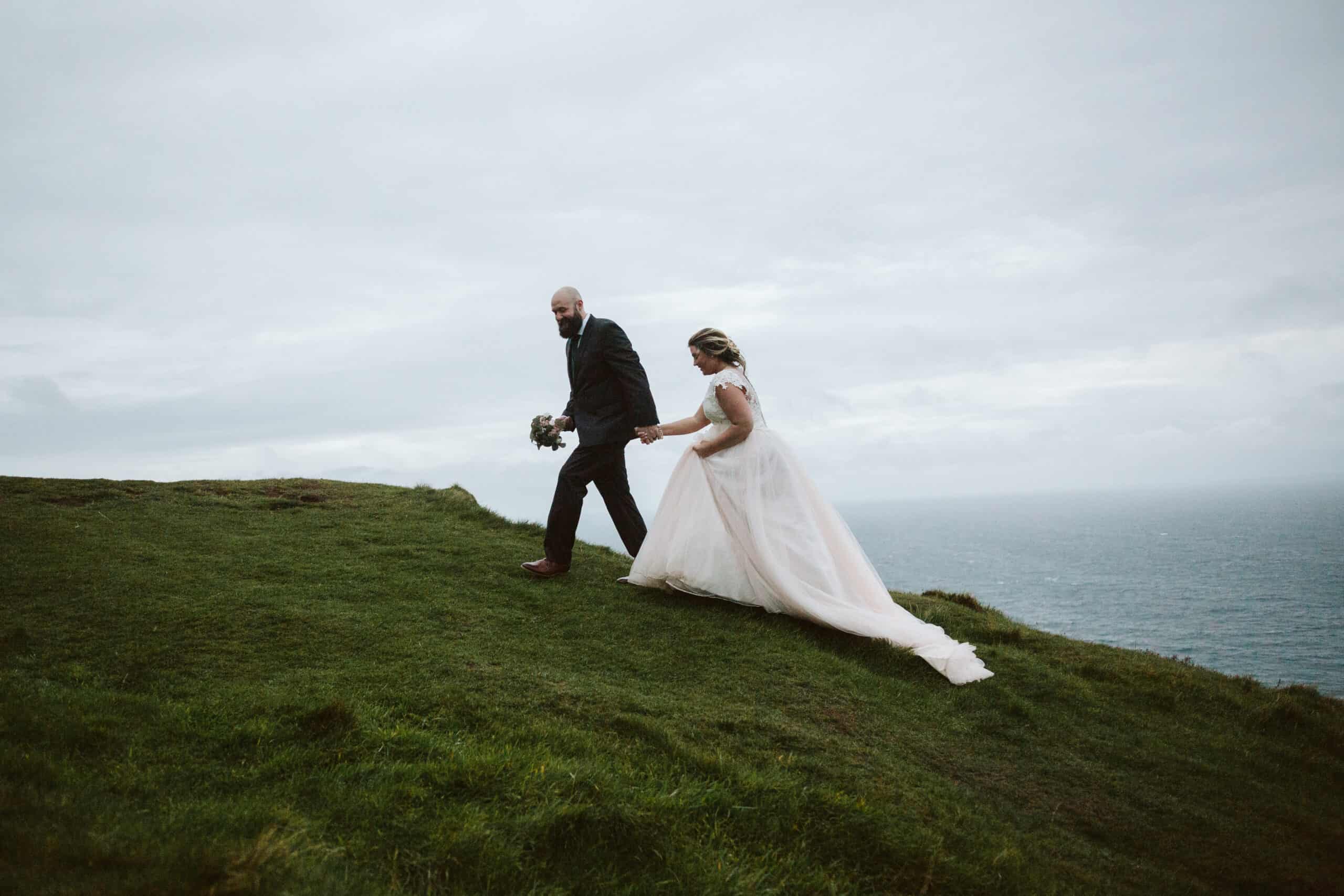 Cliffs of Moher Wedding Hags head, couple walk and hold hands